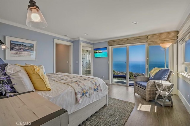 bedroom featuring baseboards, access to outside, ornamental molding, and wood finished floors