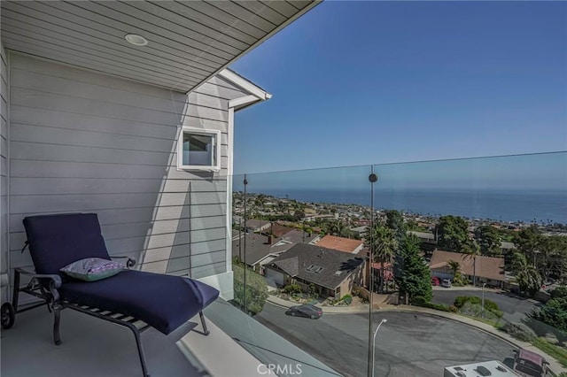 balcony featuring a water view