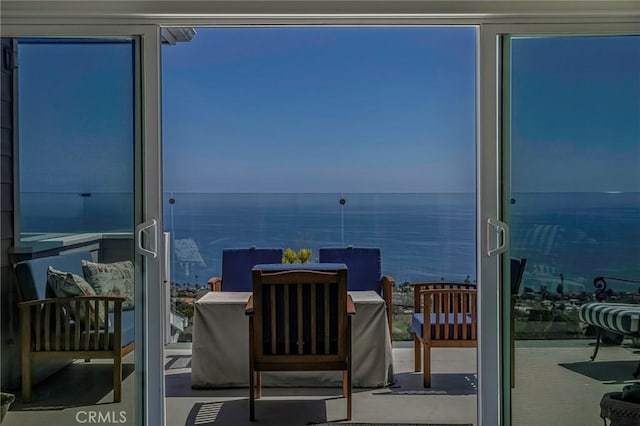 balcony featuring a water view