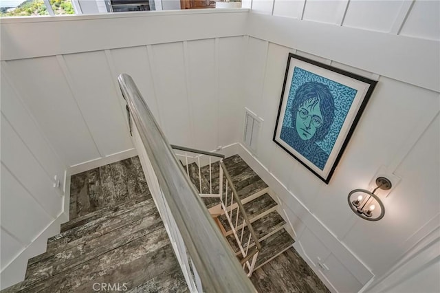 stairway with hardwood / wood-style floors