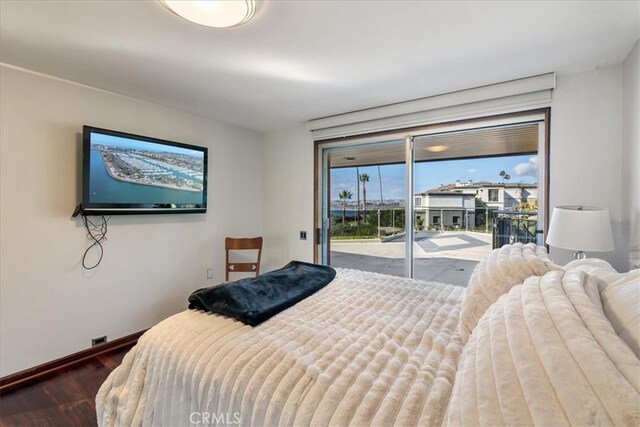 bedroom featuring hardwood / wood-style flooring and access to outside