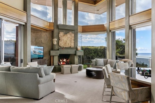 sunroom / solarium with a large fireplace