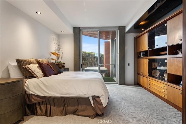 carpeted bedroom with access to exterior and expansive windows