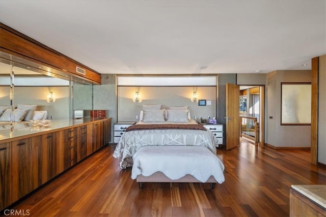 bedroom featuring dark hardwood / wood-style floors