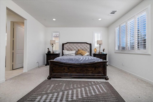 bedroom featuring light colored carpet