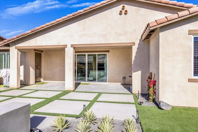 back of property with a patio area