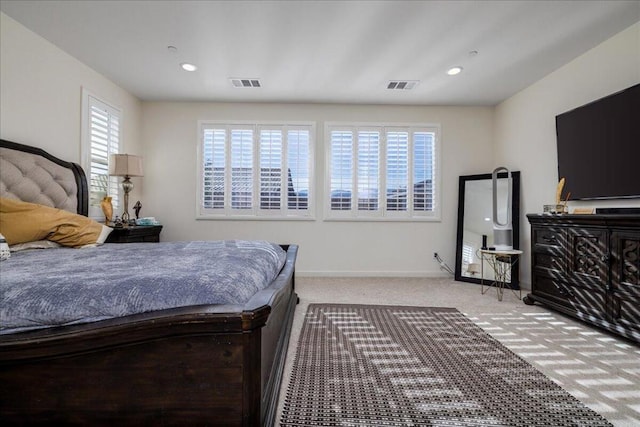 bedroom with light carpet