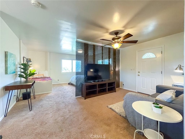 carpeted living room featuring ceiling fan