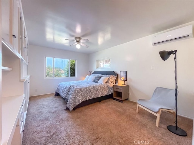 carpeted bedroom with a wall mounted air conditioner and ceiling fan