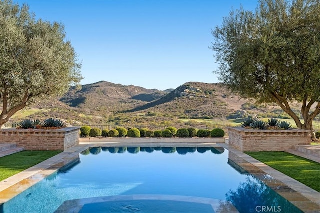 view of pool with a mountain view