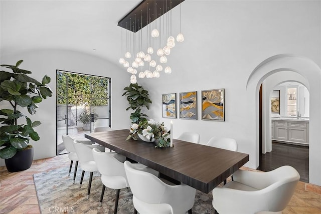 dining space featuring lofted ceiling