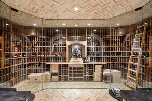 wine room featuring parquet flooring and brick ceiling