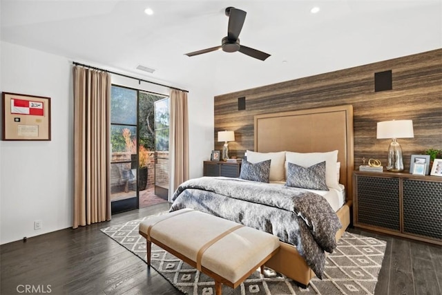 bedroom with access to exterior, dark hardwood / wood-style floors, and ceiling fan