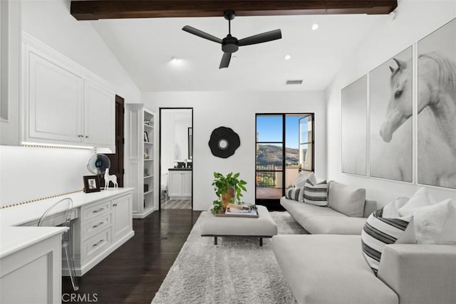 living room featuring ceiling fan, dark hardwood / wood-style flooring, and vaulted ceiling