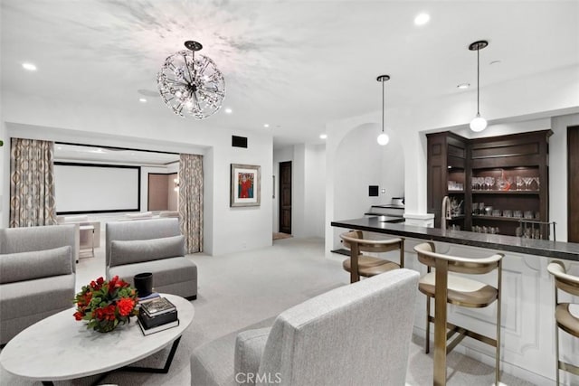 carpeted living room featuring indoor wet bar