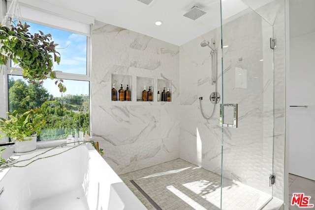 bathroom featuring an enclosed shower