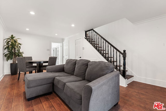 living room with ornamental molding and dark hardwood / wood-style floors