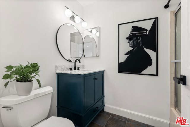 full bathroom with vanity, toilet, and bath / shower combo with glass door