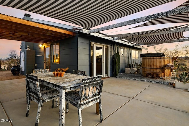 view of patio featuring outdoor dining area