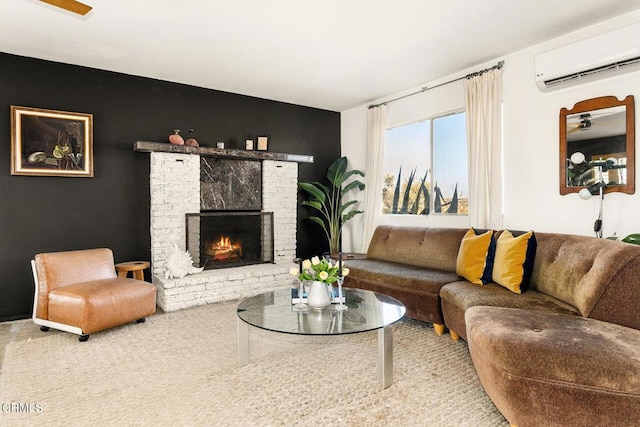 living room with a wall unit AC and a brick fireplace