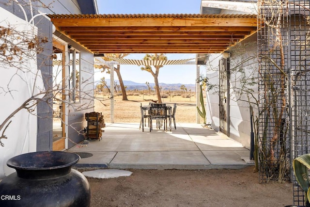 view of patio featuring a mountain view and a pergola