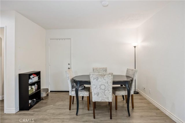 dining room with light hardwood / wood-style flooring