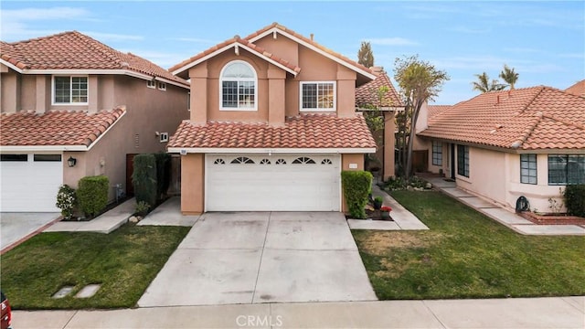 view of front of home with a garage and a front lawn