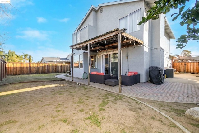 rear view of house featuring an outdoor hangout area, a patio, and central air condition unit