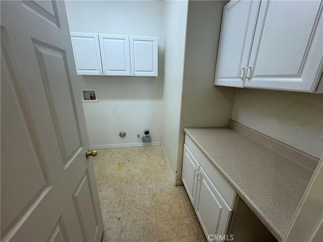 laundry area featuring gas dryer hookup, hookup for an electric dryer, cabinets, and washer hookup