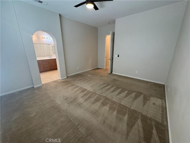 carpeted empty room with ceiling fan