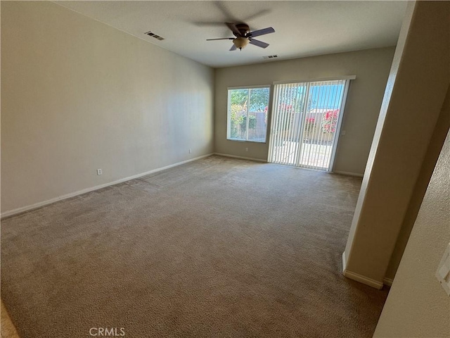 empty room with light carpet and ceiling fan