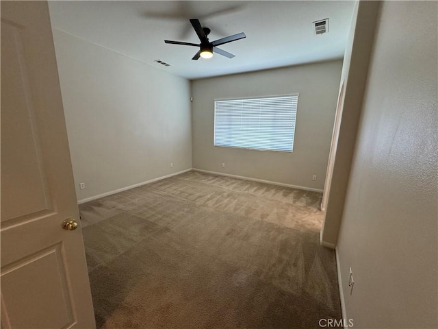 carpeted empty room with ceiling fan