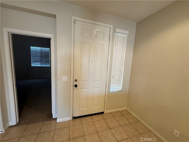 interior space with light tile patterned floors