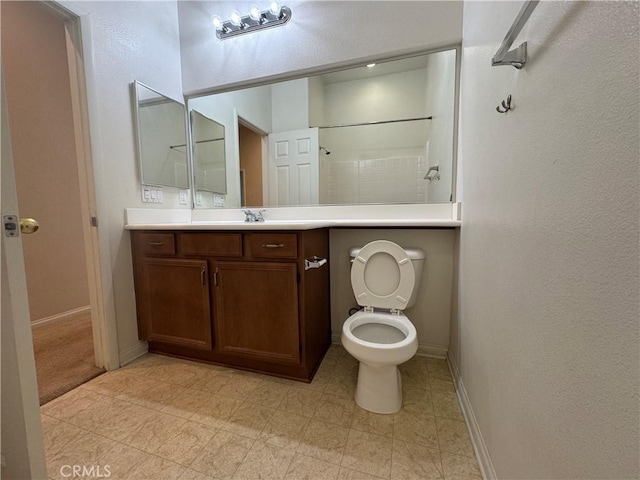 bathroom with a shower, toilet, and vanity