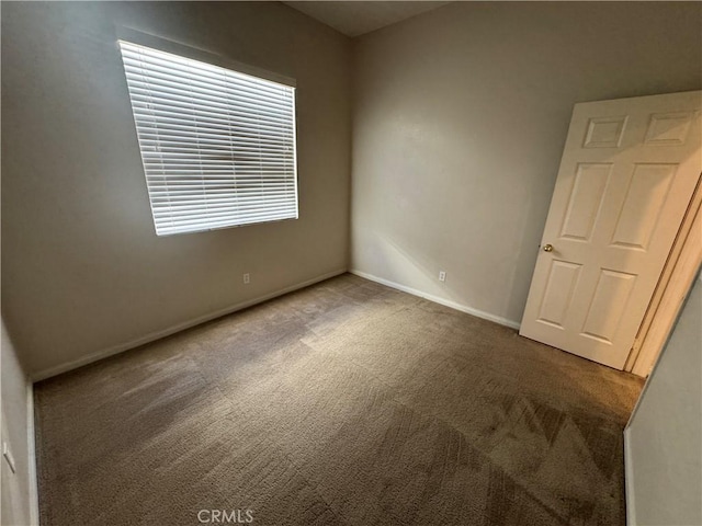 view of carpeted spare room