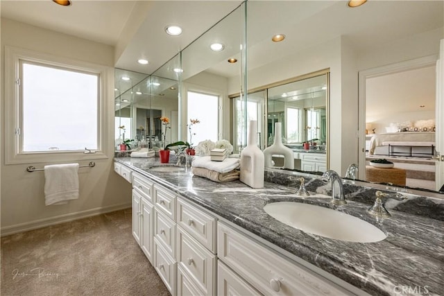 bathroom featuring a healthy amount of sunlight and vanity