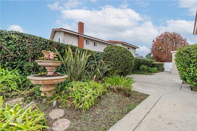 view of side of property with a patio