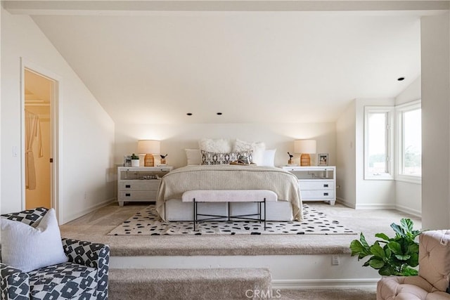 bedroom featuring lofted ceiling and light colored carpet