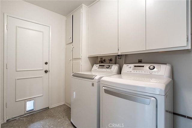 laundry area featuring cabinets and washer and dryer