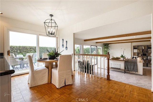 dining room featuring beamed ceiling, parquet flooring, and a notable chandelier