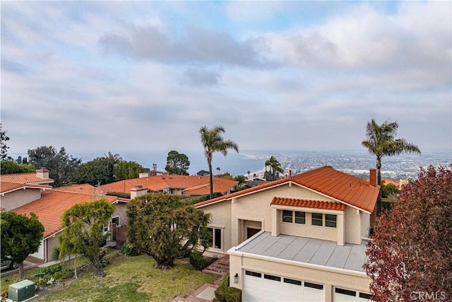 view of front of property with a garage and a front yard