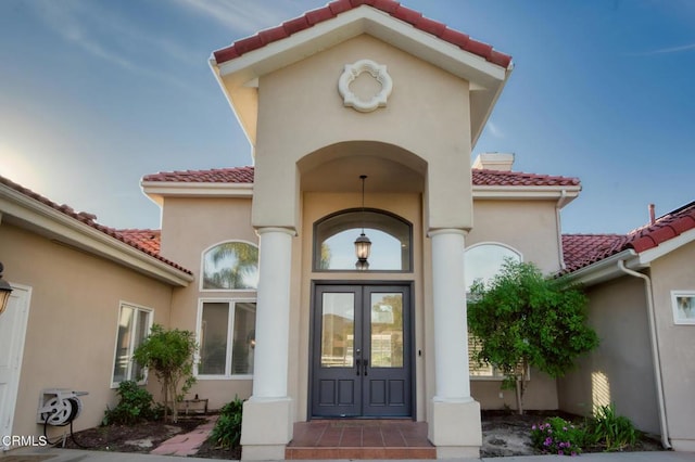 property entrance featuring french doors