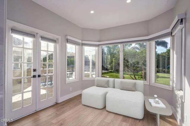 sunroom / solarium featuring a wealth of natural light and french doors