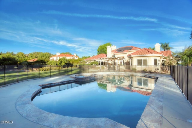 view of pool with an in ground hot tub and a pergola