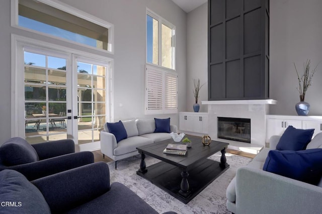 living room featuring a wealth of natural light and light hardwood / wood-style floors