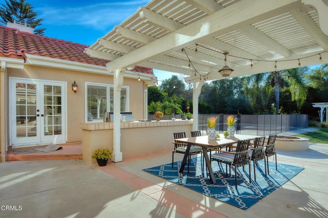 view of patio featuring french doors and a pergola