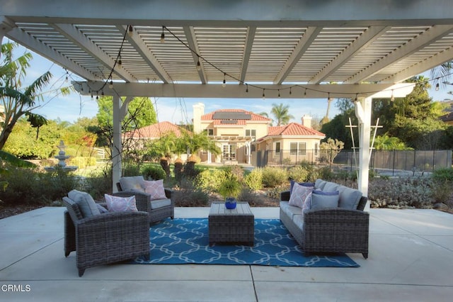 view of patio / terrace with an outdoor living space and a pergola