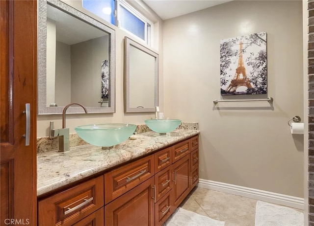 bathroom with tile patterned floors and vanity