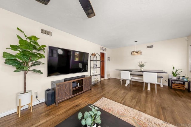 living room with dark hardwood / wood-style floors