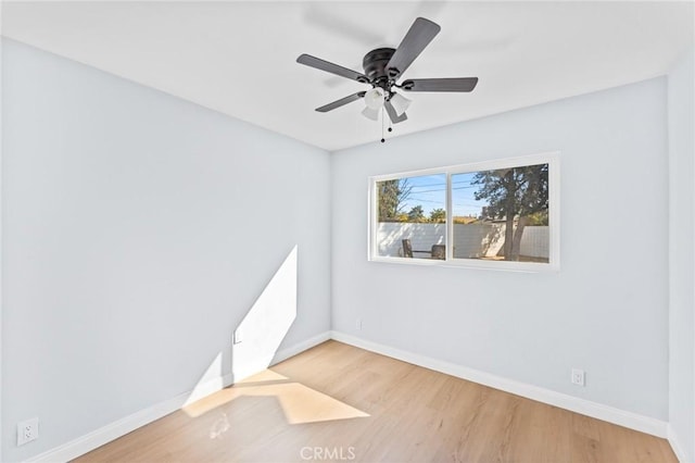 unfurnished room featuring hardwood / wood-style flooring and ceiling fan